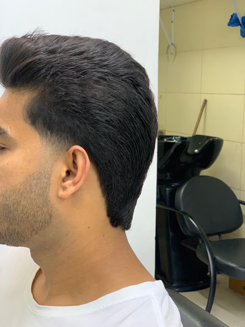 Classic men's haircut profile after grooming service